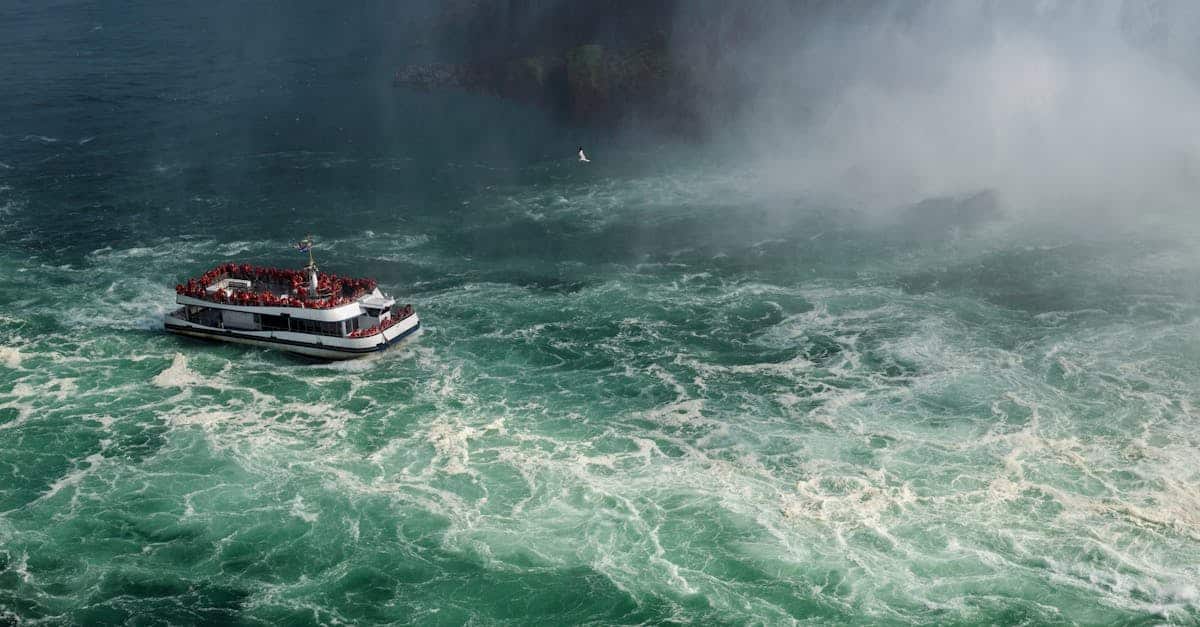 A tourist boat ventures close to the powerful waters of Niagara Falls in Ontario, Canada.